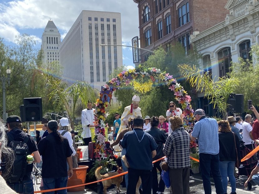 The Blessing of the Animals with Los Angeles City Hall in background in downtown Los Angeles on To Live and Dine in LA Food Tours' Chinatown and Olvera Street Food Tour.