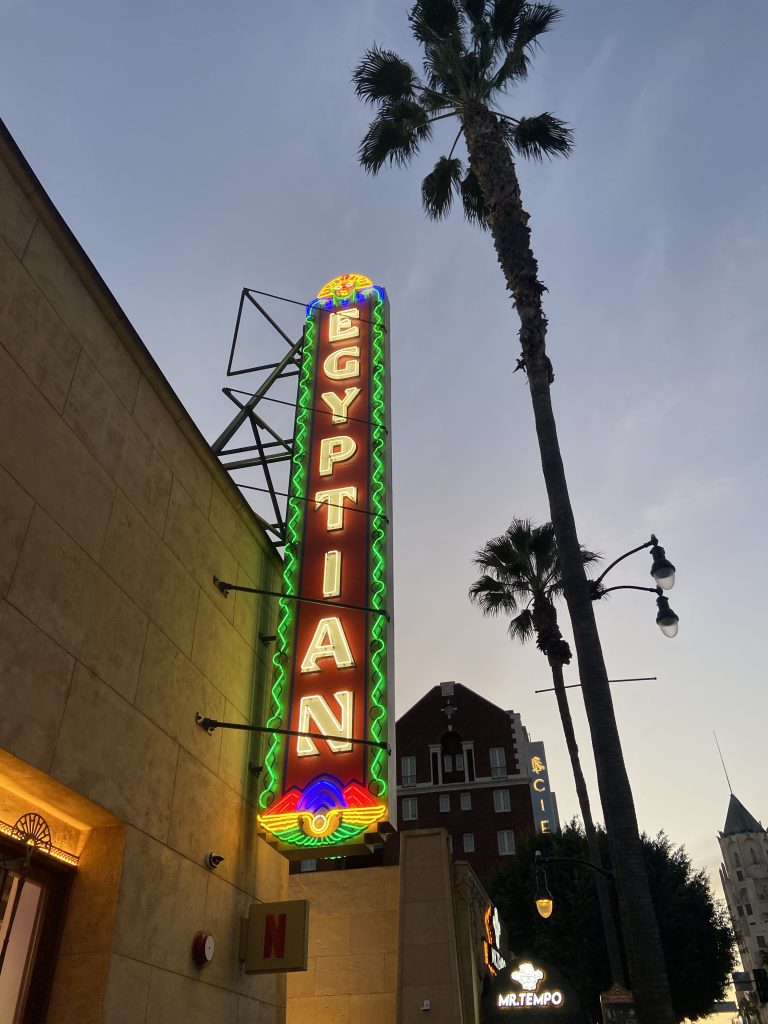 The Egyptian Theater's neon sign on a Hollywood Food Tour run by To Live and Dine in LA Food Tours.