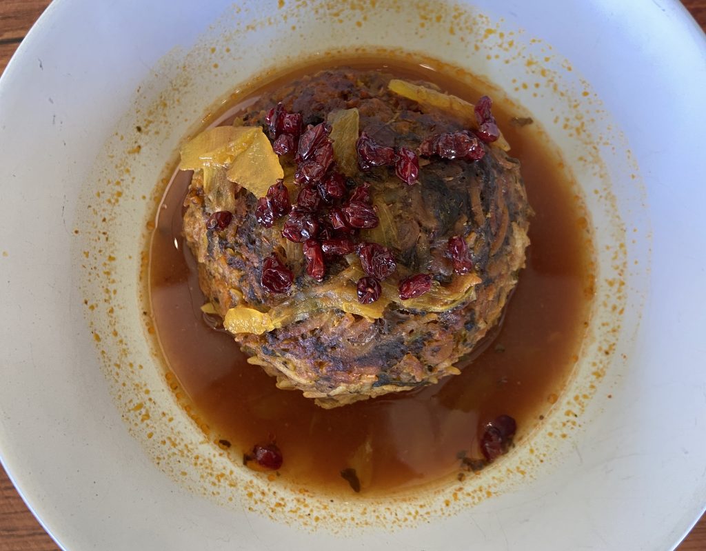 Persian kofteh tabrizi, a braised beef and rice meatball stuffed with dried stone fruity and walnut, on a Silver Lake Food Tour in Los Angeles run by To Live and Dine in LA Food Tours.